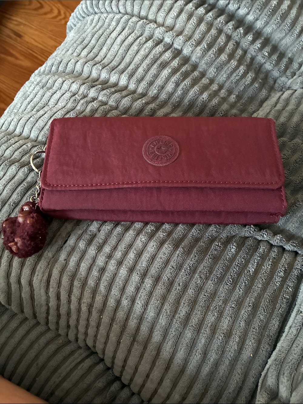 Kipling Deep Burgundy Quilted Wallet with Pom Charm